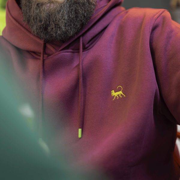 Close up of the Lébrett logo on the Grove Hoodie in Plum.