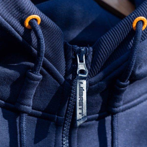 Lébrett Empire Hoodie in Navy. Image of the embossed zipper on this premium casual wear.